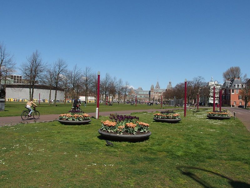 Museumplein's bike path with cyclist on it.