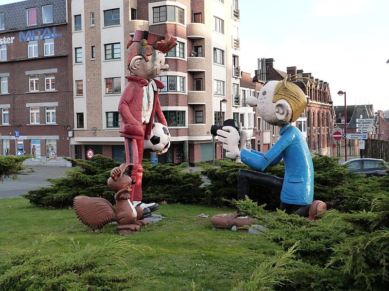 Two cartoon characters displayed in Charleroi as part of the comic book scene within the city's street art.