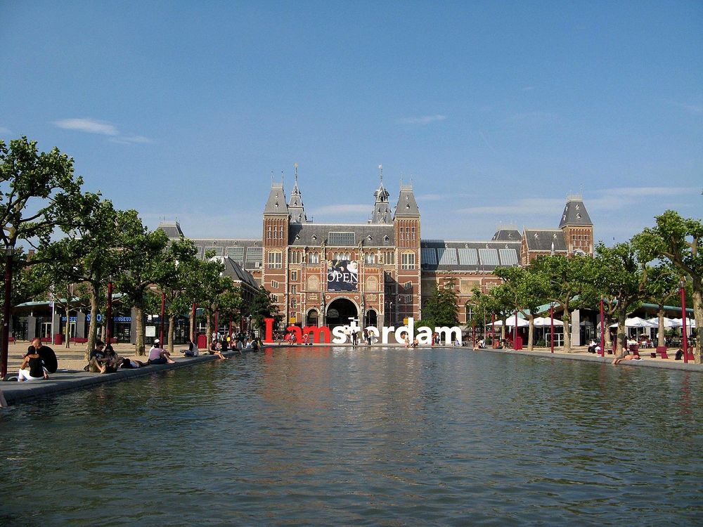 Museumplein during the summer with a pond filled with water.