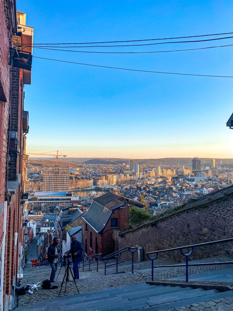 Two men taking photos on the stairs of Montagne de Bueren, Liege, Belgium