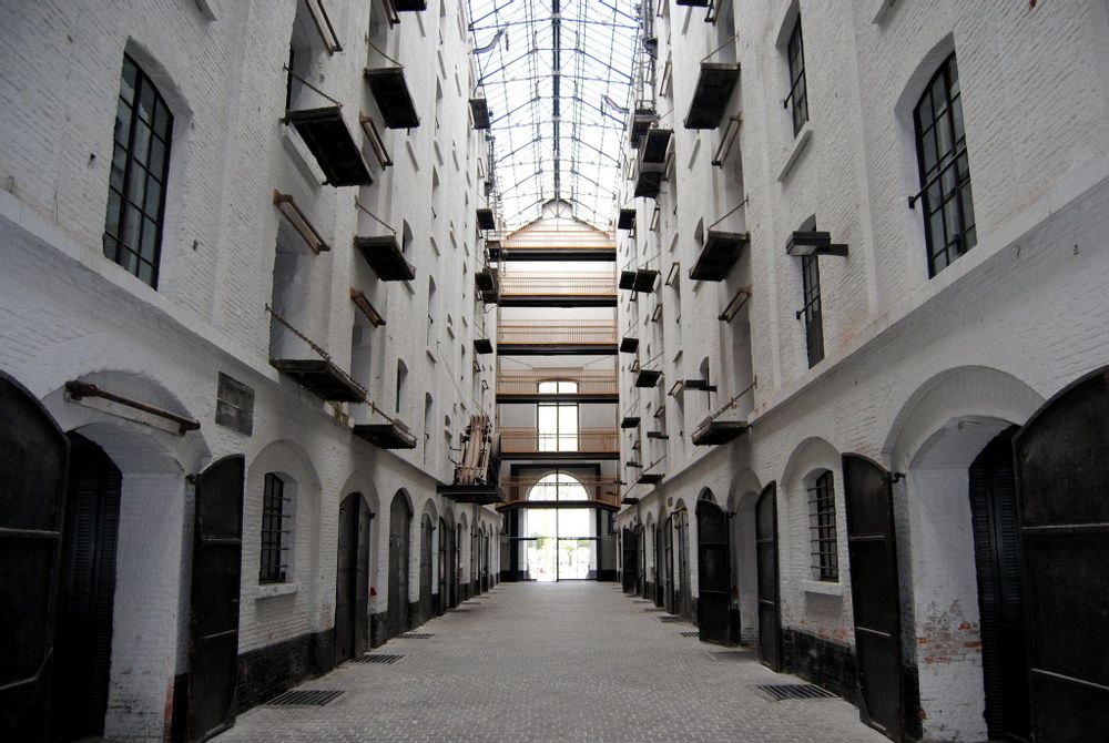 19th century indoor white brick alleyway with high glass dome ceiling. 