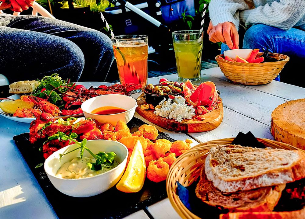 Food and drinks on a table in front of people