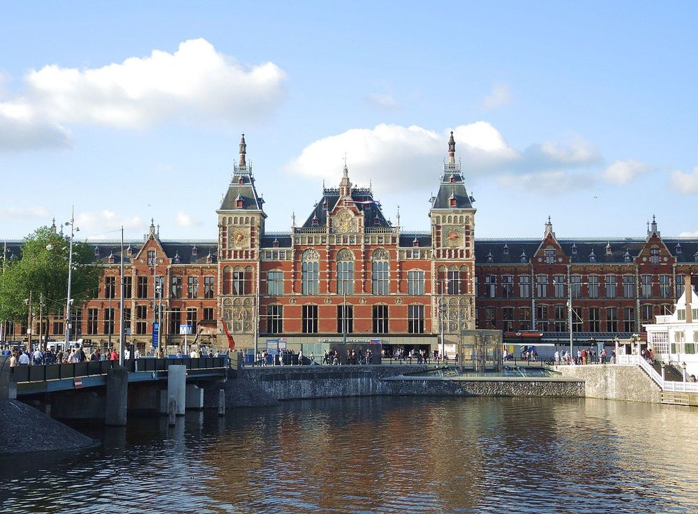Amsterdam Centraal Station by the water.