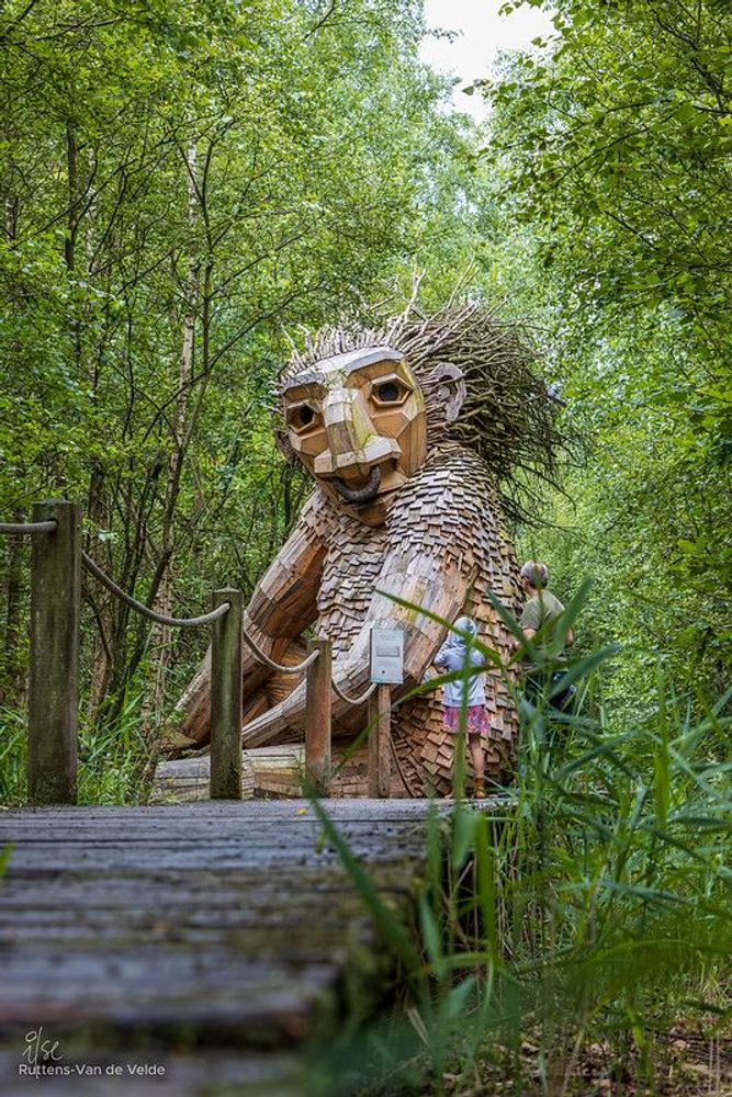Large troll on a wooden pathway in De Schorre Boom, part of the 7 trolls designed by Thomas Dambo