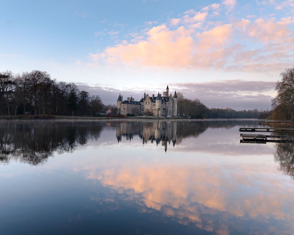 Lake with castle in the distance. Castle Marnix de Sainte Aldegonde, Antwerp, Belgium