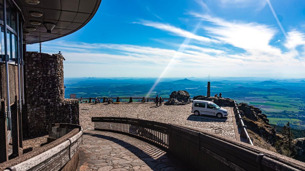 Van parked outside Jested tower with a view of the fields in Liberec