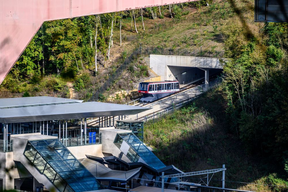 A view of the funicular coming out of the hillside.