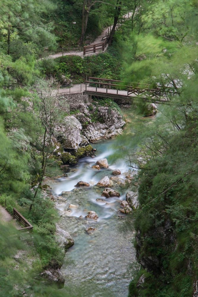 Walkway bridges built above the rushing waters of Tolmin Gorge.