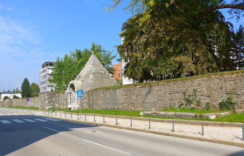 The Roman Wall running all around Ljubljana's modern street.