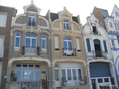 Three story houses with balcony windows 
