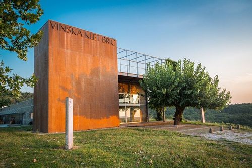 The exterior facade of the Posestvo Brič building in the hillside.
