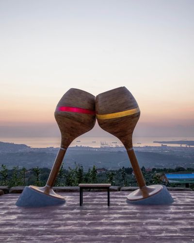 Two sculptures of wine on a hill overlooking Vinska Fontana Marezige.